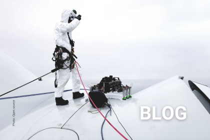 WTG Technician and drone on wind turbine