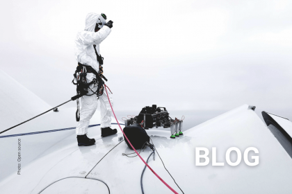 WTG Technician and drone on wind turbine